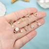 imageORAZIO 9 PCS Dangle Nose Rings  L Shaped for Women 20G Stainless Steel Nose Rings Studs with CZ Cross Crown Flower Heart Dangling Piercing JewelrySGold Tone