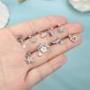 imageORAZIO 9 PCS Dangle Nose Rings  L Shaped for Women 20G Stainless Steel Nose Rings Studs with CZ Cross Crown Flower Heart Dangling Piercing JewelrySSilver Tone